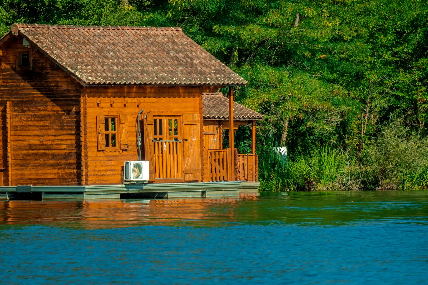 Wooden floating chalet on the private lake at Domaine du Dahu