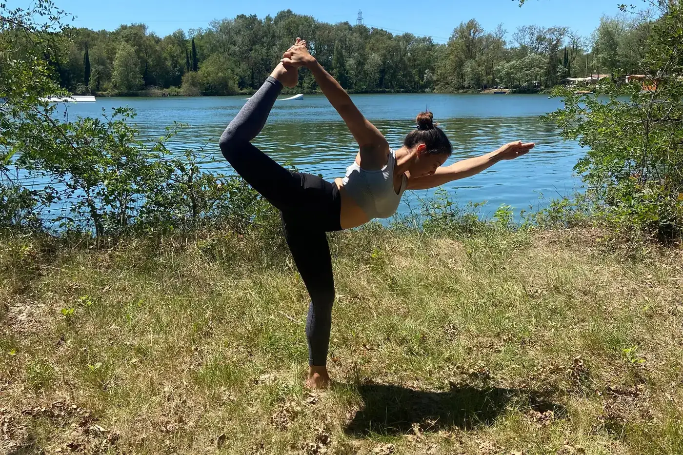 Yoga session on the shore of the private lake at Domaine du Dahu
