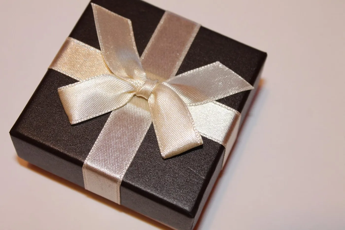 Elegant gift box with a ribbon, a gift idea for a romantic night away